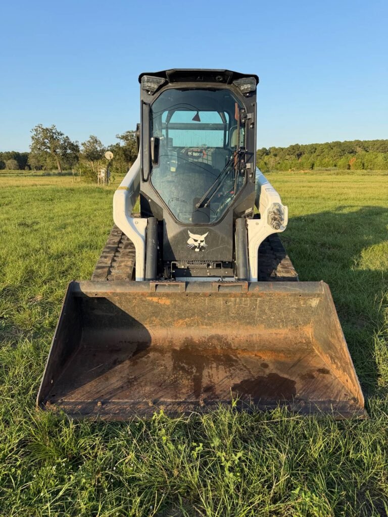 Bobcat T66 track loader rental, front view with bucket